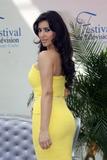 Kim Kardashian busty in yellow dress at Keeping Up With the Kardashians photocall during the 2008 Monte Carlo Television Festival, in Monaco
