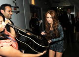http://img188.imagevenue.com/loc537/th_28842_Miley_Cyrus_Gr_123_537lo.jpg